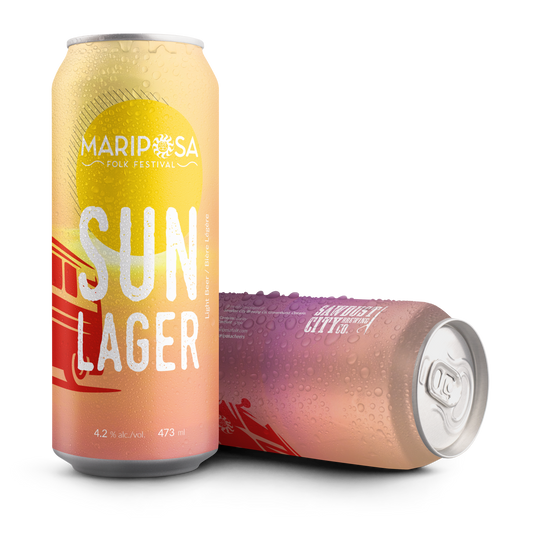 Two Mariposa Folk Festival 'Sun Lager' aluminum cans with a condensation effect, one standing upright and the other lying on its side, on a solid white background.